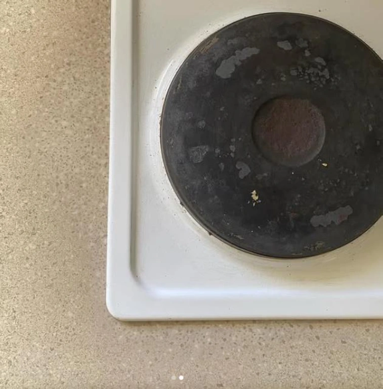 Stovetop burner on beige countertop