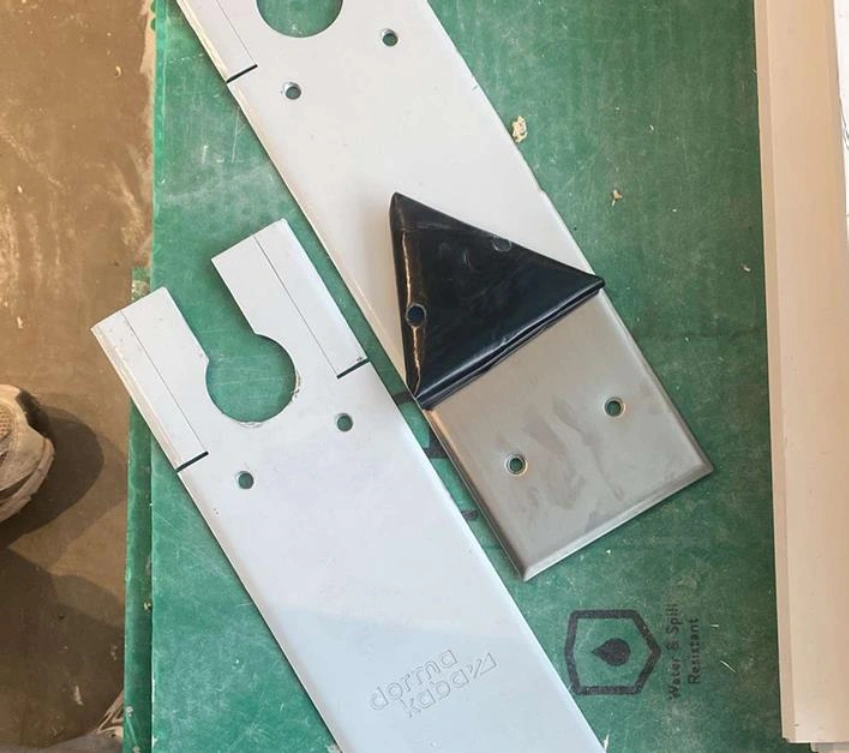 Metal parts on green surface