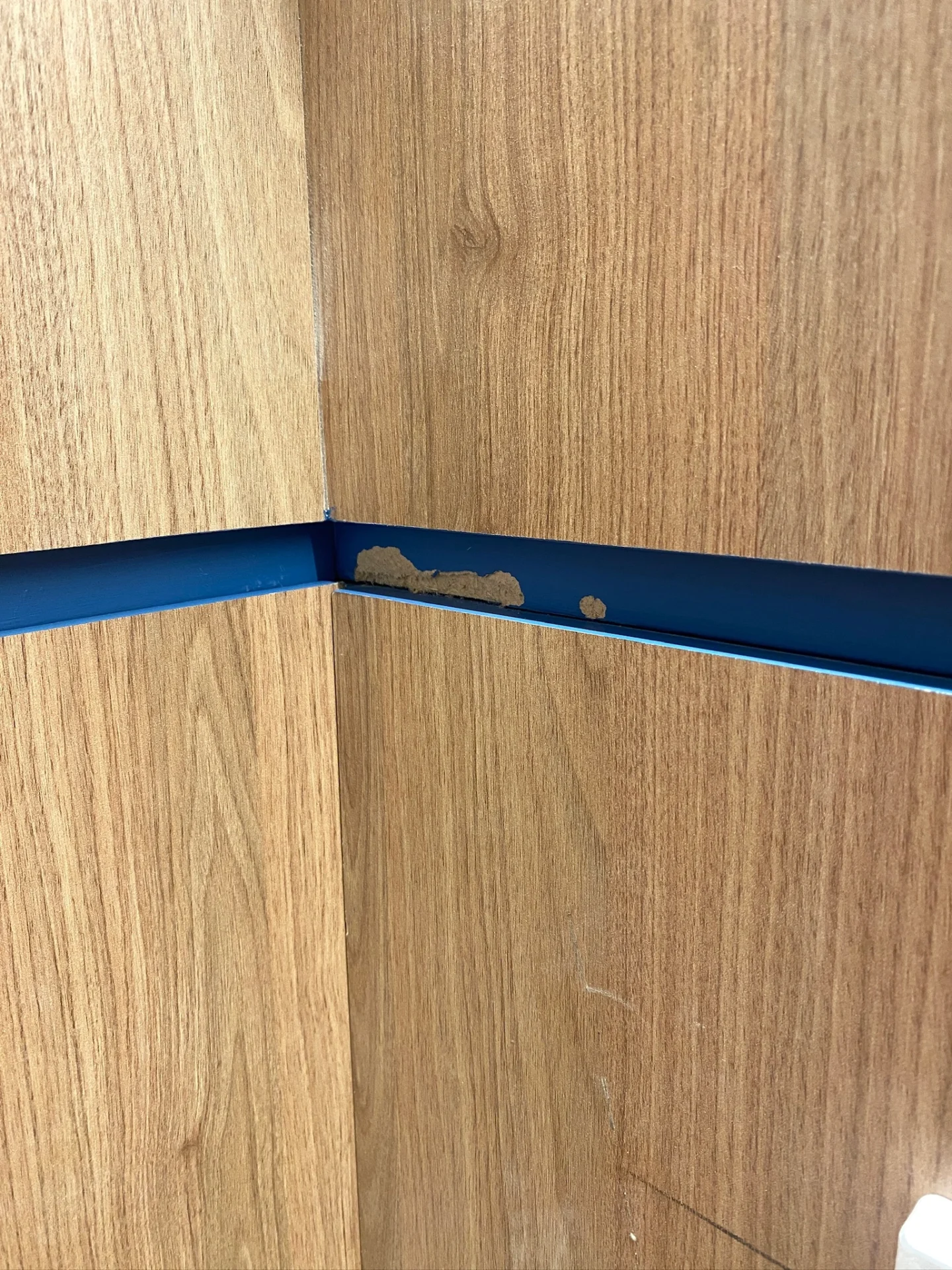 Wooden panels with blue metal trim