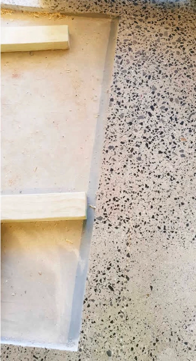 Concrete floor with terrazzo finish